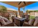 Inviting outdoor patio featuring comfortable seating and a cozy fire pit for relaxing evenings at 13270 N 93Rd Way, Scottsdale, AZ 85260