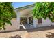 Covered patio area offering an inviting outdoor space with low-maintenance desert landscaping at 13416 W Ventura St, Surprise, AZ 85379