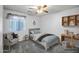 Comfortable bedroom featuring neutral tones, ceiling fan and carpeted flooring at 13416 W Ventura St, Surprise, AZ 85379
