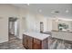 Open-concept kitchen features a stylish island and ample storage, perfect for entertaining at 13416 W Ventura St, Surprise, AZ 85379