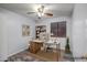 Home office with wood floors, a ceiling fan, and a large desk perfect for remote work at 13416 W Ventura St, Surprise, AZ 85379