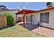 Backyard featuring a covered patio, grass, and block wall at 14235 N 26Th Dr, Phoenix, AZ 85023