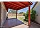 A covered patio offers shade in this backyard with block wall at 14235 N 26Th Dr, Phoenix, AZ 85023