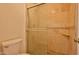 Tiled shower and toilet featuring a neutral toned tile at 14235 N 26Th Dr, Phoenix, AZ 85023