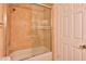 Bathroom featuring tan ceramic tiling in the shower and bathtub at 14235 N 26Th Dr, Phoenix, AZ 85023