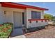 Inviting single-story home entrance with a security screen door and xeriscape landscaping at 14235 N 26Th Dr, Phoenix, AZ 85023