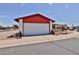 Single-story home with a two-car garage, xeriscape landscaping, and a well-maintained lawn at 14235 N 26Th Dr, Phoenix, AZ 85023