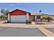 Attractive single-story home featuring a well-kept lawn and xeriscape landscaping at 14235 N 26Th Dr, Phoenix, AZ 85023