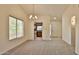 Bright living room with neutral carpet and easy access to the kitchen at 14235 N 26Th Dr, Phoenix, AZ 85023