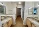 Bathroom featuring double sinks, granite counters and a walk-in shower at 15225 N 100Th St # 1220, Scottsdale, AZ 85260