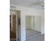 Bedroom featuring a ceiling fan and closet with sliding mirrored doors at 15225 N 100Th St # 1220, Scottsdale, AZ 85260