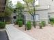Exterior of a building with mature landscaping and well-maintained grounds at 15225 N 100Th St # 1220, Scottsdale, AZ 85260
