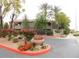 Attractive community entrance and sign with flower beds and well-maintained landscaping at 15225 N 100Th St # 1220, Scottsdale, AZ 85260
