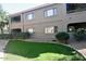 Exterior of building with grassy area, plants, and well-maintained walkway at 15225 N 100Th St # 1220, Scottsdale, AZ 85260