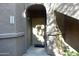 A close up shot of the unit's front door, with a covered entryway and the unit number, 1220, visible at 15225 N 100Th St # 1220, Scottsdale, AZ 85260