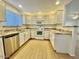 Modern kitchen featuring white cabinets, granite countertops, and stainless steel appliances at 15225 N 100Th St # 1220, Scottsdale, AZ 85260