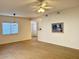 Bright living room featuring tile flooring, a ceiling fan, and views into the kitchen area at 15225 N 100Th St # 1220, Scottsdale, AZ 85260