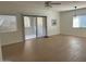 Neutral living room with tile floors, ceiling fan, slider doors, and lots of natural light at 15225 N 100Th St # 1220, Scottsdale, AZ 85260