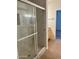 Elegant walk-in shower featuring marble-patterned walls with glass door at 15225 N 100Th St # 1220, Scottsdale, AZ 85260