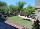 View from window with lush, green landscaping, rocks, plants and gated access at 15225 N 100Th St # 1220, Scottsdale, AZ 85260