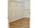 Spacious walk-in closet with wood floors and wire shelving for ample storage at 15225 N 100Th St # 1220, Scottsdale, AZ 85260