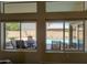 View through windows to the backyard, highlighting the pool and patio area at 15273 S 31St St, Phoenix, AZ 85048