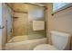 Clean bathroom showcasing a tiled shower/tub and a modern toilet at 15273 S 31St St, Phoenix, AZ 85048