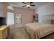 Cozy bedroom with soft pink accents, plush carpeting, and a large comfortable bed at 15273 S 31St St, Phoenix, AZ 85048