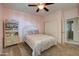 Comfortable bedroom with carpet, neutral colored walls, and a large window for natural light at 15273 S 31St St, Phoenix, AZ 85048