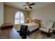 Comfortable bedroom featuring carpet, a desk, and a large window for natural light at 15273 S 31St St, Phoenix, AZ 85048