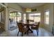Charming breakfast nook with round table, wicker chairs, and view of the pool area at 15273 S 31St St, Phoenix, AZ 85048