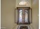 Inviting foyer showcasing tile floors and an elegant wrought iron double door entry at 15273 S 31St St, Phoenix, AZ 85048
