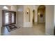 Inviting foyer with arched doorways, tiled floor, and a decorative front door at 15273 S 31St St, Phoenix, AZ 85048