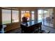 Well-lit office space with large windows offering views of the pool and backyard at 15273 S 31St St, Phoenix, AZ 85048