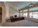 Inviting living room featuring vaulted ceilings, a ceiling fan, and backyard views at 15273 S 31St St, Phoenix, AZ 85048