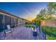 Inviting backyard with brick-paved patio, manicured artificial lawn, and tasteful landscaping perfect for relaxation at 16042 W Shaw Butte Dr, Surprise, AZ 85379