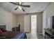 Comfortable bedroom featuring a modern ceiling fan and ensuite bathroom at 16042 W Shaw Butte Dr, Surprise, AZ 85379
