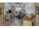 The exercise room features workout machines, a wall mounted TV, and natural light with shuttered windows at 16042 W Shaw Butte Dr, Surprise, AZ 85379