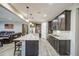 Bright kitchen with stainless steel appliances, granite countertops, and a large center island at 16042 W Shaw Butte Dr, Surprise, AZ 85379