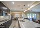 Modern kitchen featuring stainless steel appliances, granite counters, and pendant lighting at 16042 W Shaw Butte Dr, Surprise, AZ 85379