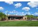 Exterior view of a McDowell Mountain Ranch home with desert landscaping, mountains, and a blue cloudy sky at 16861 N 106Th Way, Scottsdale, AZ 85255