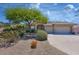 Charming single-story home featuring a three-car garage and desert landscaping in a well-maintained community at 16861 N 106Th Way, Scottsdale, AZ 85255