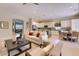Open-concept living room showcasing a modern kitchen, dining area, and comfortable seating at 16861 N 106Th Way, Scottsdale, AZ 85255