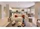 Inviting living space with contemporary furnishings, a view into the kitchen, and ample lighting at 16861 N 106Th Way, Scottsdale, AZ 85255