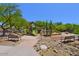 Community playground with slides, climbing structure, and benches, perfect for families to enjoy outdoor recreation at 16861 N 106Th Way, Scottsdale, AZ 85255