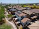 An aerial view of a home showcasing the backyard, patio and landscaping in a well maintained neighborhood at 17613 N 114Th Ln, Surprise, AZ 85378