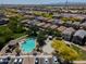 An aerial perspective of community pool, playground, basketball court, and neighborhood at 17613 N 114Th Ln, Surprise, AZ 85378