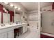 Bathroom featuring a double vanity, garden tub, and a separate glass shower at 18622 N 28Th Way, Phoenix, AZ 85050
