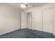 This bedroom features carpet, a ceiling fan, and a closet at 18622 N 28Th Way, Phoenix, AZ 85050