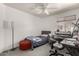 This bedroom features a ceiling fan, carpet, and a desk at 18622 N 28Th Way, Phoenix, AZ 85050